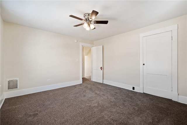 carpeted empty room with ceiling fan