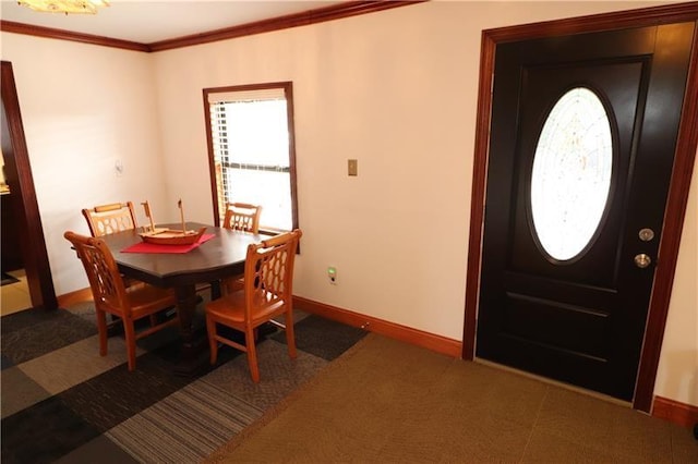 dining area with crown molding and dark carpet