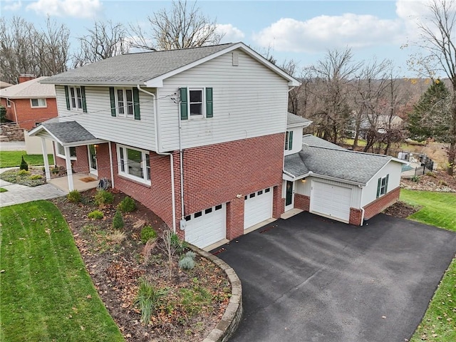 view of property exterior with a porch, a lawn, and a garage