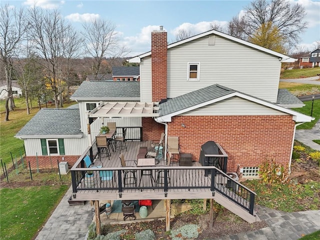 back of property featuring a wooden deck