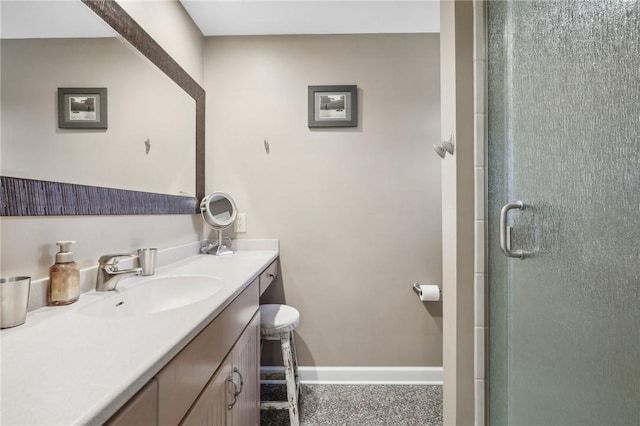 bathroom featuring an enclosed shower and vanity