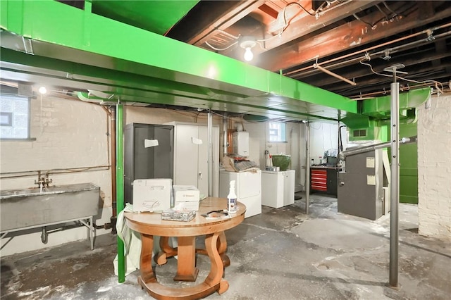 basement featuring washer and dryer and sink