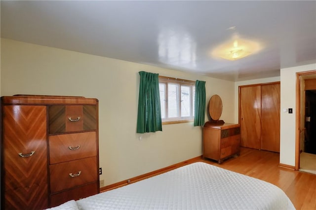 bedroom with a closet and light wood-type flooring