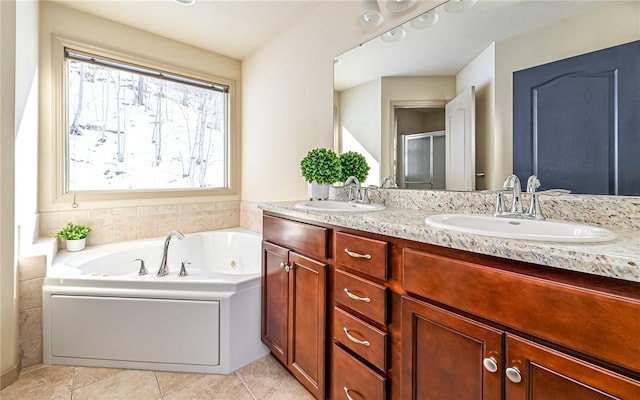 bathroom with independent shower and bath, tile patterned flooring, and vanity