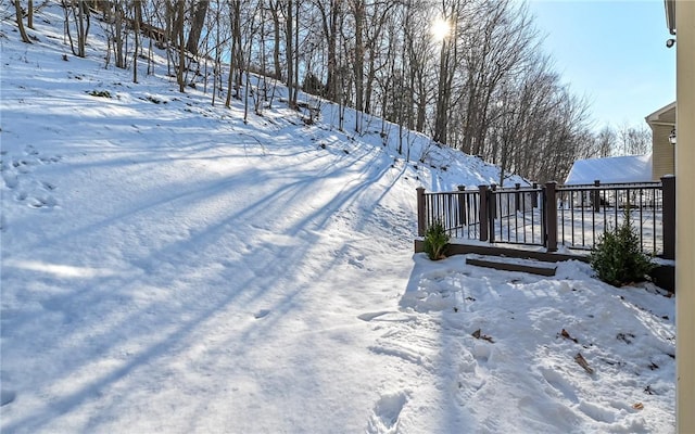 view of yard layered in snow