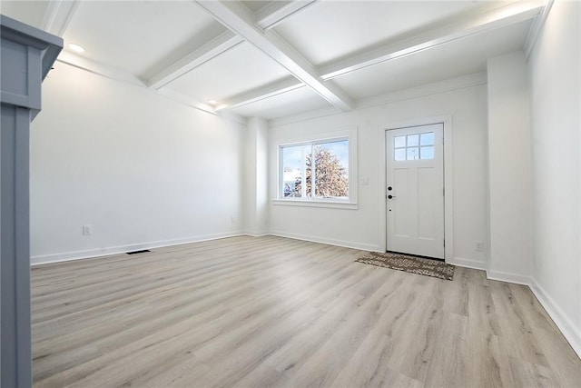 foyer entrance with light hardwood / wood-style floors, coffered ceiling, and beam ceiling