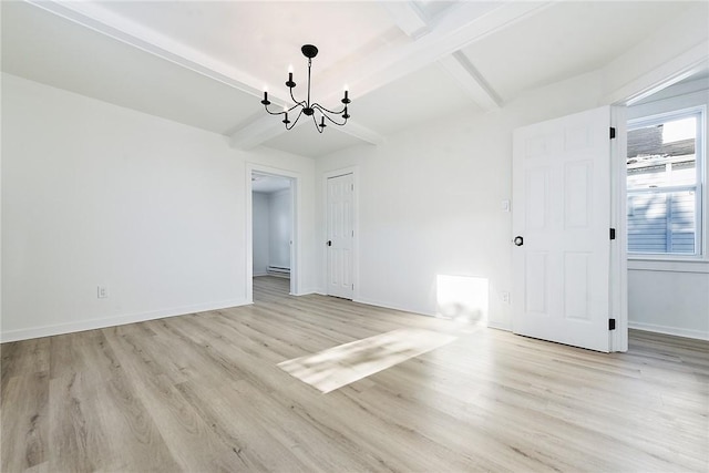 spare room featuring a baseboard heating unit, a chandelier, beamed ceiling, and light hardwood / wood-style flooring