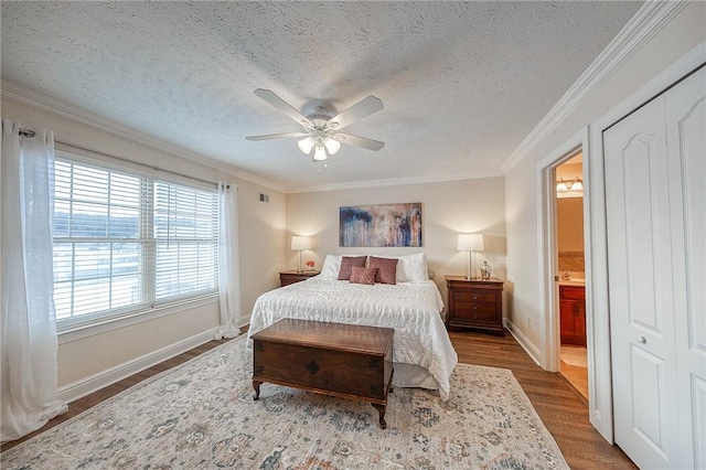 bedroom with ceiling fan, crown molding, a closet, and dark hardwood / wood-style floors