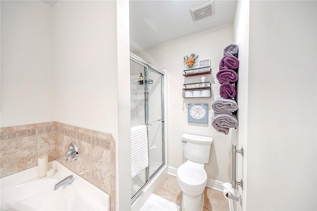 bathroom with toilet, an enclosed shower, tile patterned flooring, and a textured ceiling