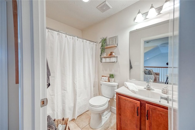 bathroom featuring tile patterned flooring, vaulted ceiling, toilet, vanity, and a textured ceiling