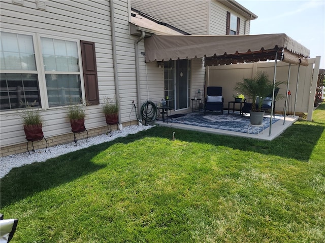 exterior space featuring a lawn and a patio area