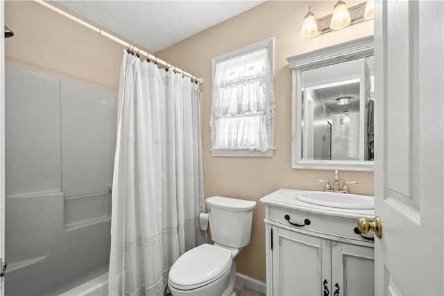 bathroom with toilet, a textured ceiling, and vanity