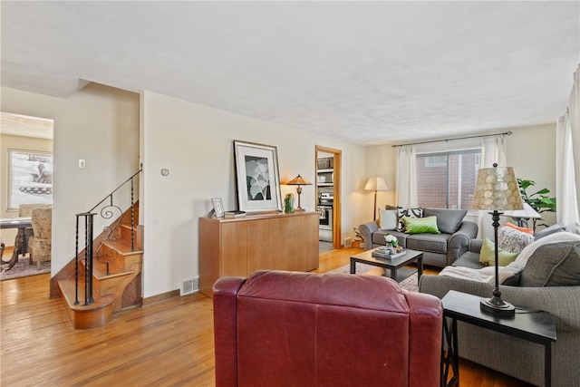 living room with light hardwood / wood-style flooring