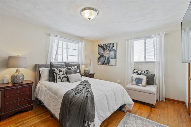 bedroom with light wood-type flooring