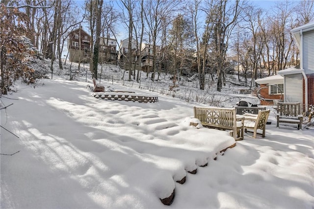 view of yard layered in snow