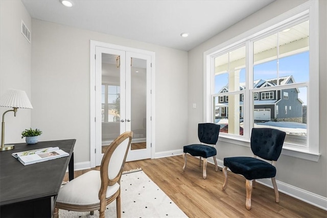 office area featuring hardwood / wood-style floors and french doors