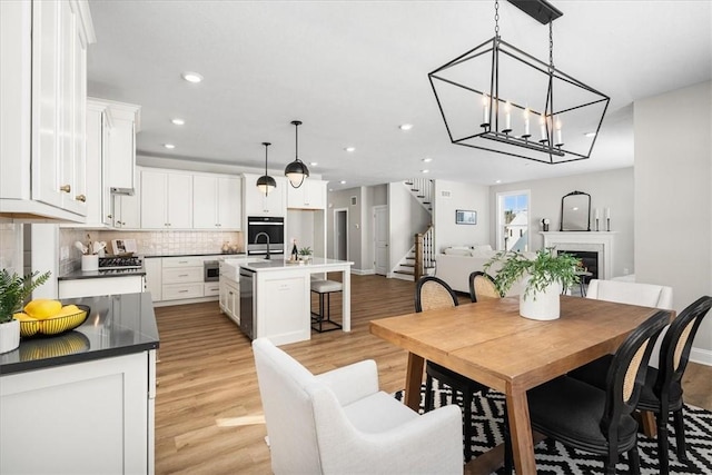 dining area featuring a chandelier and light hardwood / wood-style floors