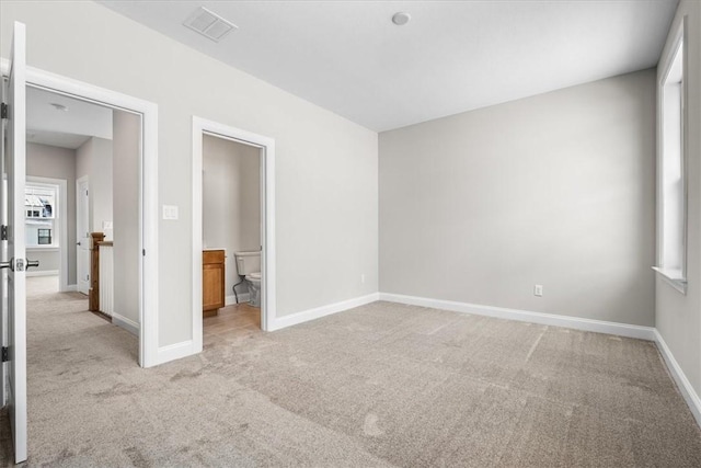 unfurnished bedroom with light carpet