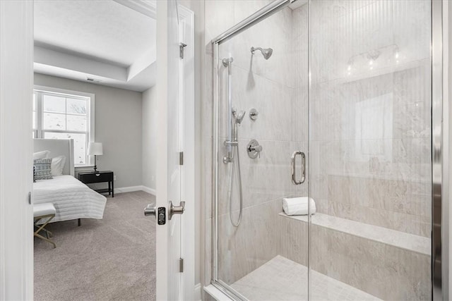 bathroom featuring a shower with shower door