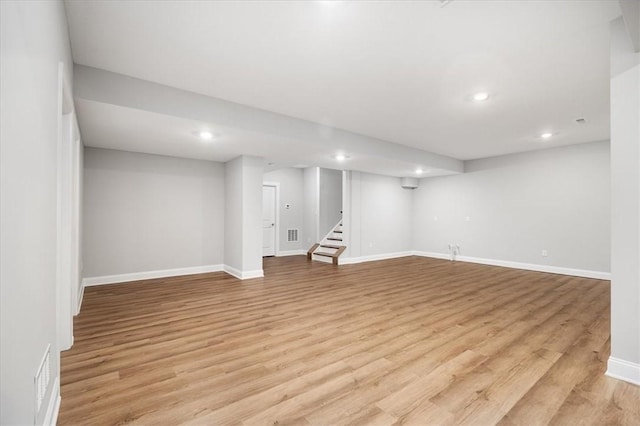 basement featuring light wood-type flooring