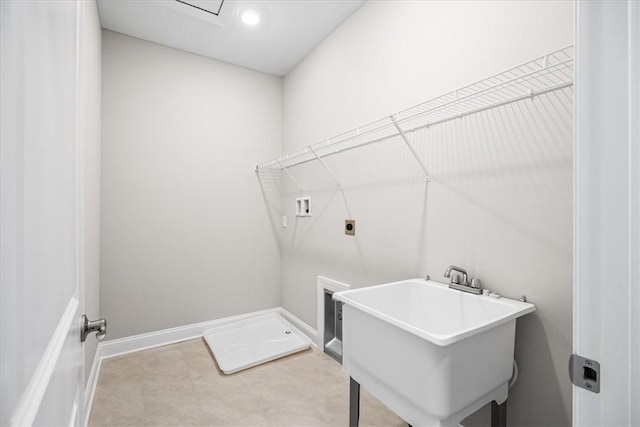 washroom featuring washer hookup, hookup for an electric dryer, and sink