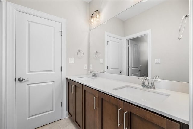 bathroom with vanity and tile patterned flooring