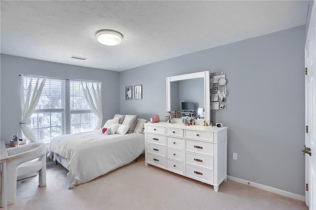 bedroom with light carpet