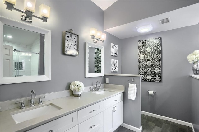 bathroom featuring vanity, hardwood / wood-style floors, and walk in shower