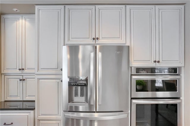 kitchen with white cabinetry and stainless steel appliances