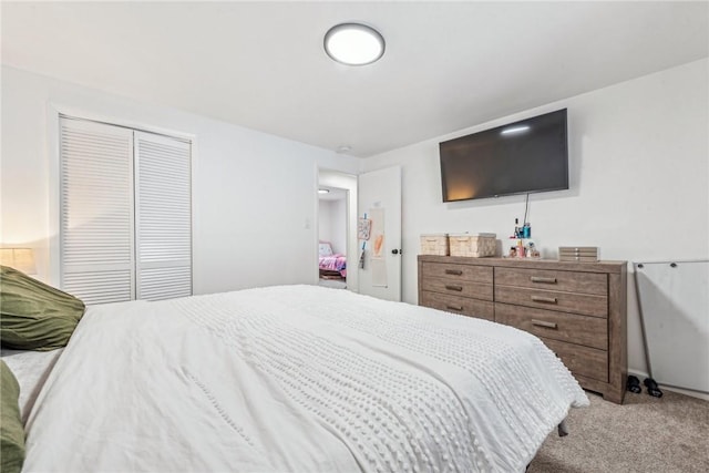 carpeted bedroom featuring a closet