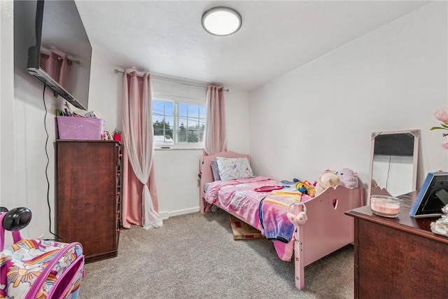 bedroom featuring light carpet