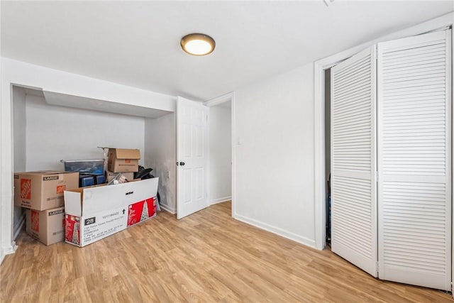 basement featuring light wood-type flooring