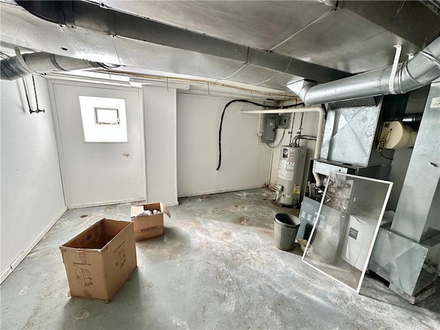 basement featuring water heater and electric panel