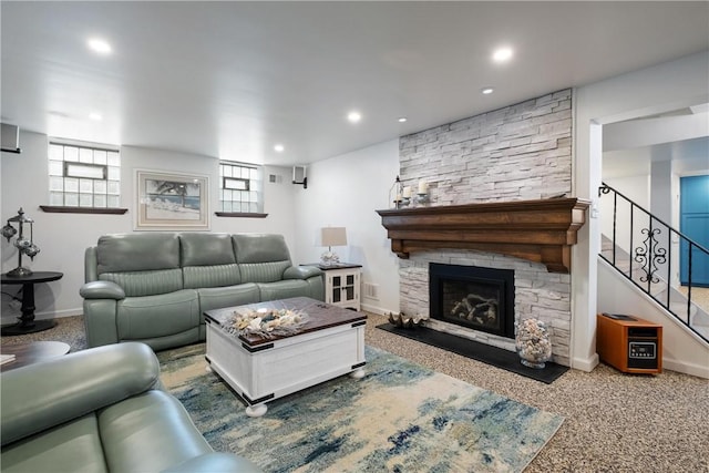 living room featuring carpet flooring and a fireplace