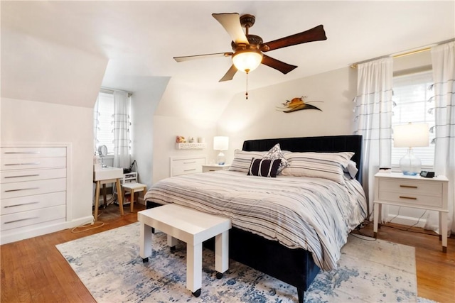 bedroom with ceiling fan and wood-type flooring