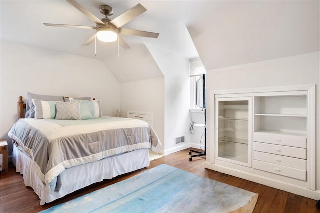 bedroom with ceiling fan, hardwood / wood-style floors, and lofted ceiling