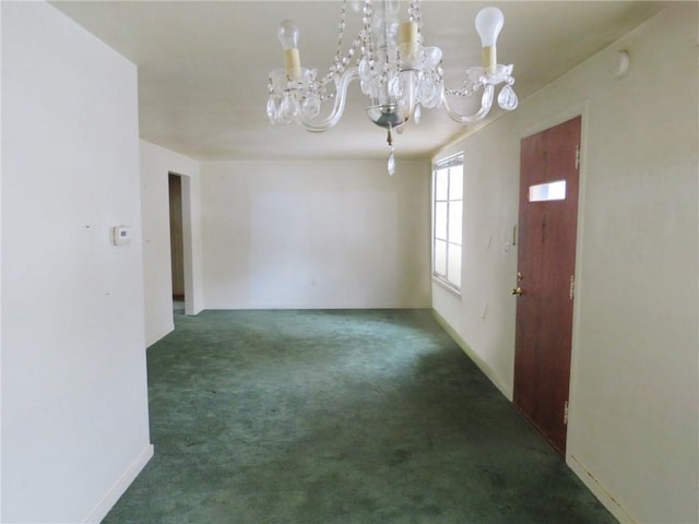 carpeted empty room with baseboards and an inviting chandelier