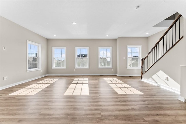 unfurnished living room with light hardwood / wood-style floors