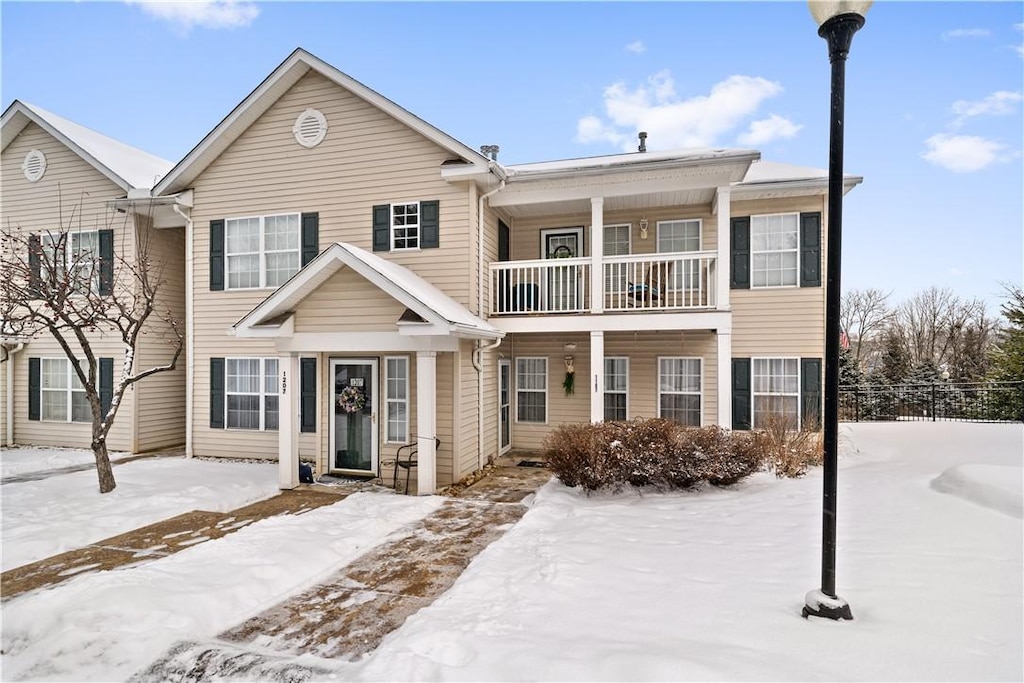 view of front of home with a balcony