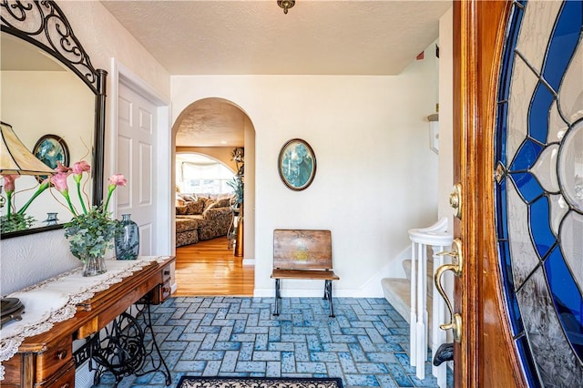 interior space with a textured ceiling