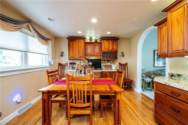 dining area featuring light wood-type flooring