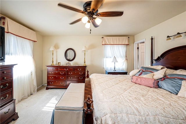 bedroom featuring light carpet and ceiling fan