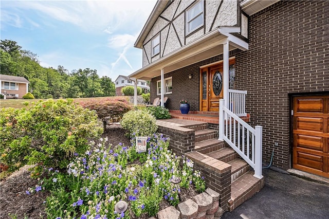 property entrance featuring a porch