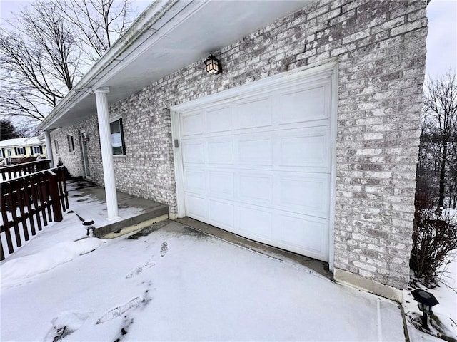 view of snow covered garage