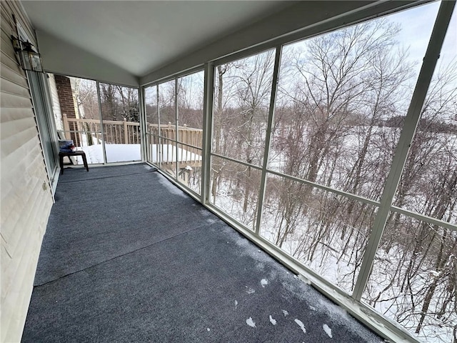 unfurnished sunroom with vaulted ceiling