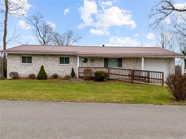 single story home with a garage and a front yard