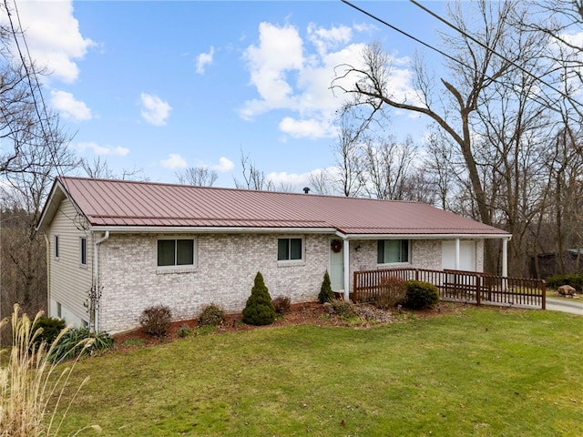 view of front of property with a front yard and a deck