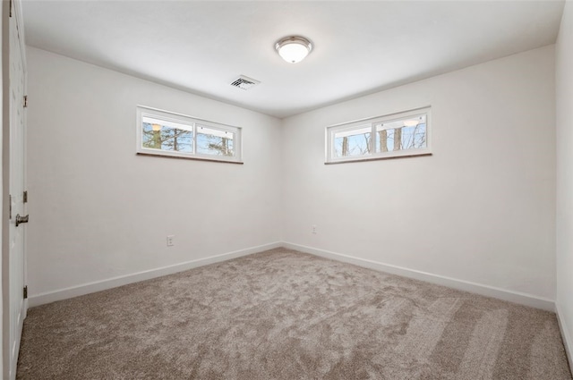 spare room with carpet floors and a healthy amount of sunlight