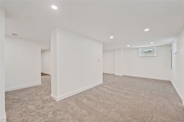 basement with light colored carpet