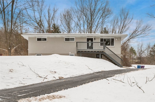 view of front of property featuring a wooden deck